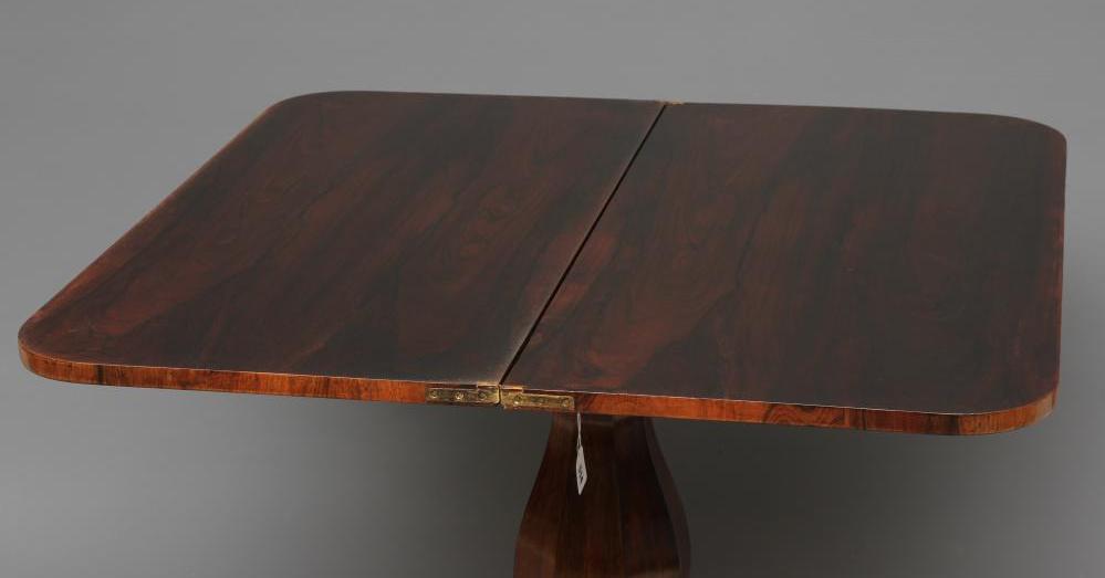 A VICTORIAN ROSEWOOD FOLDING TEA TABLE of rounded oblong form with swivel top, faceted baluster stem - Image 4 of 4