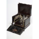 A BOULLE AND LACQUER CAVE A LIQUEUR, mid 19th century, of serpentine form, the hinged cover and fall