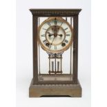 A BRASS FOUR GLASS MANTEL CLOCK, late 19th century, the twin barrel movement with compensating
