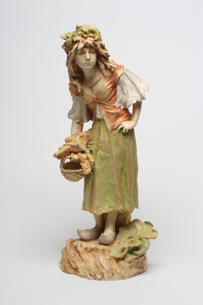 AN AMPHORA FIGURE of a young Dutch girl, early 20th century, standing wearing a wreath of oak