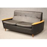 A SCHREIBER MAPLE(?) FRAMED SOFA BED, mid 20th century, button upholstered in black faux leather,