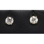 A PAIR OF SOLITAIRE MOISSANITE EAR STUDS on white metal posts (Est. plus 21% premium inc. VAT)