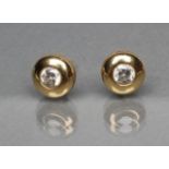 A PAIR OF DIAMOND SOLITAIRE STUD EARRINGS, the collet set round brilliant cut stones in plain 18ct