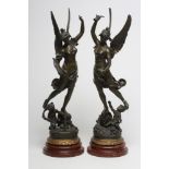 AFTER VICTOR ROUSSEAU (1865-1954) a pair of bronzed spelter figures of Commerce and Industry, on