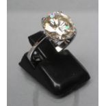 A MOISSANITE SOLITAIRE RING, the brilliant cut stone of approximately 3.4cts claw set to a plain