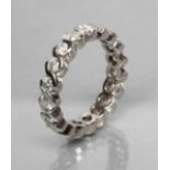 A DIAMOND ETERNITY RING, the 18ct white gold shank collet set with numerous brilliant cut stones,
