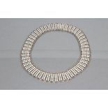 A NORWEGIAN SILVER AND WHITE ENAMEL COLLAR made up of fifty two pairs of ten white enamelled