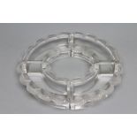 A LALIQUE CLEAR GLASS FOUR PIECE HORS D'OEUVRES SET, the dishes with everted gadrooned rim, engraved