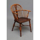 A YEW WINDSOR ARMCHAIR, 19th century, of low hoop back form with shaped and pierced splat,