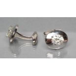 A PAIR OF OVAL SILVER CUFFLINKS each set with an oval cut moissanite, unmarked (Est. plus 21%
