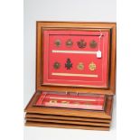 FIVE FRAMED DISPLAYS OF BRITISH MILITARY CAP BADGES, the forty badges include Fusiliers,