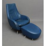A ROLF BENZ BLUE LEATHER SWIVEL ARMCHAIR, the tapering back with straight top rail, downswept