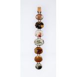 A VICTORIAN SCOTTISH AGATE BRACELET, the seven polished banded and moss agate stones collet set in
