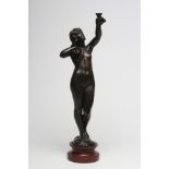 A BRONZE FIGURAL TABLE LAMP, early 20th century, modelled as a standing nude maiden holding aloft