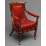 A WILLIAM IV MAHOGANY FRAMED BERGERE upholstered in red leather, the curved padded back with