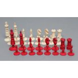 AN ANGLO INDIAN IVORY CHESS SET, mid 19th century, stained red and natural, with turned sectional