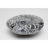 A PETER LAYTON GLASS "BOWL" of organic pebble form with a dark blue ripple and mottled effect,