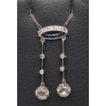 AN ART DECO DIAMOND AND SAPPHIRE NECKLACE, the two knife edge bars each claw set with an old mine