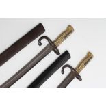 TWO FRENCH YATAGHAN SWORD BAYONETS, for the Chassepot, dated 1870 and 1872, with ribbed brass