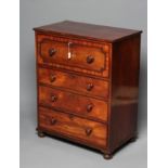 A LATE GEORGIAN MAHOGANY SECRETAIRE CHEST, the banded and beaded secretaire drawer fitted with