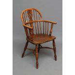 A YEW WINDSOR ARMCHAIR, 19th century, of low hoop back form with shaped and pierced splat,