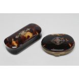 A VICTORIAN TORTOISESHELL OVAL PURSE, the upper section inlaid with a vacant panel, hinged and