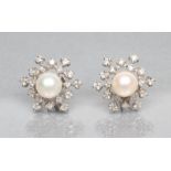 A PAIR OF DIAMOND AND PEARL STUD EARRINGS, the peg set cultured white pearls within a diamond set
