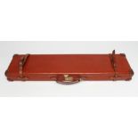 A BRADY LEATHER SHOTGUN CASE with fitted baize interior, Brady label, twin belt straps and