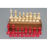 A CANTONESE IVORY CHESS SET, mid 19th century, stained red and natural, with turned sectional