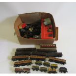 Playworn Trix Twin Railways rolling stock including P.O. coal wagons, oil tankers, L.M.S. coaches