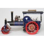 A Maxwell Hemmens 1" scale steam roller, coal fired boiler, single cylinder to gear box, water pump,
