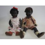 Two bisque socket head black baby dolls, one with brown glass flirty eyes, the other sleeping,