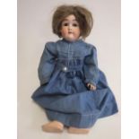 A Max Handwerck bisque socket head doll, with brown glass sleeping eyes, open mouth with teeth,