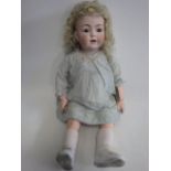 A Franz Schmidt & Co bisque socket head doll, with blue glass sleeping eyes, open mouth, teeth and