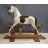 A Haddon Rockers dappled grey rocking horse, with painted fibre glass body, turning head, open