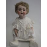 An Armand Marseille bisque socket head doll, with blue glass sleeping eyes, open mouth with teeth,