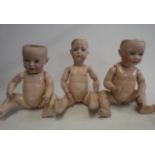 Three damaged bisque socket head dolls, comprising a 23 1/2" Bruno Schmidt 2097-6, a 22" UNIS France