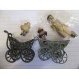Two pierced metal and florally decorated dolls house prams, with all bisque babies and an all bisque