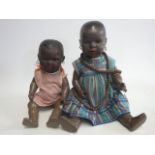 A Heubach Koppelsdorf black baby doll, with brown glass sleeping eyes, open mouth, moulded hair,