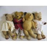 Four vintage bears, including a yellow panda and a 20" bear wearing fine pyjamas (Est. plus 21%