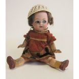 A Heubach bisque socket head flirty doll, with blue glass flirty and sleeping eyes, closed mouth,