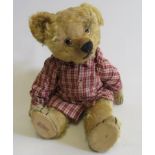 A pre-war Chad Valley growling teddy, with clear plastic eyes, celluloid maker's button to ear, sewn