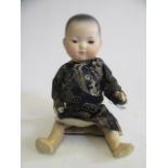 An Armand Marseille "ELLAR" bisque socket head oriental doll, with fixed brown glass eyes,
