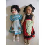 Two French Raynard type dolls, both with composition painted faces and cloth bodies, one with