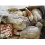 A quantity of spare doll parts including bisque heads, cloth and leather bodies (Est. plus 21%