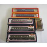 Three Bachmann coaches G.W.R. and B.R. and two Hornby L.M.S. Coronation coaches, all items boxed,