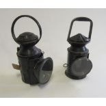 Two British Railways porters lamps, one has broken glass with oil burner, the other has no glass