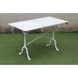 A GARDEN TABLE, modern, the oblong veined white marble top on painted metal end supports, the