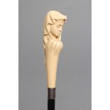 A LADY'S VICTORIAN WALKING CANE, the ivory grip carved as the head of a young maiden wearing a veil,
