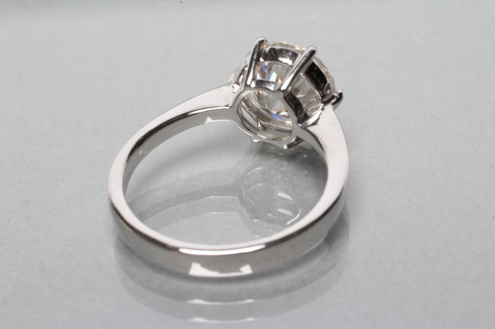 A MOISSANITE SOLITAIRE RING, the brilliant cut stone of approximately 2.5cts, claw set to a plain - Image 2 of 2